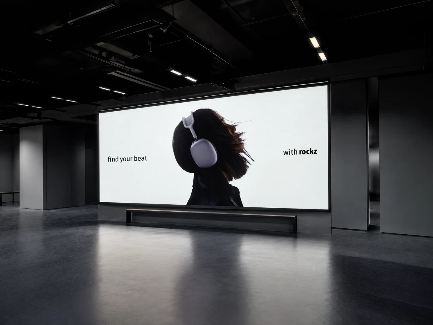 A clean white billboard pairs a headphone portrait with widely spaced copy.