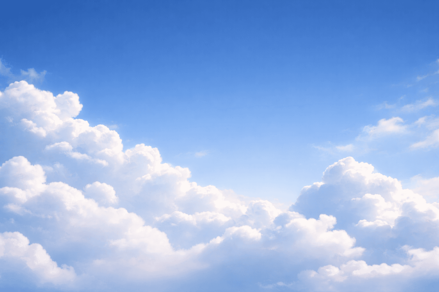 soft white clouds in a bright blue sky