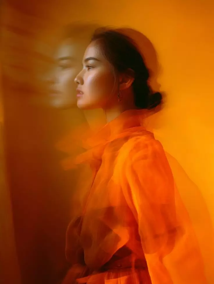 woman wearing orange dress