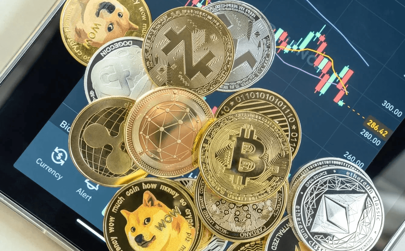 Various cryptocurrency coins on tablet - How to Buy Crypto Before Listing