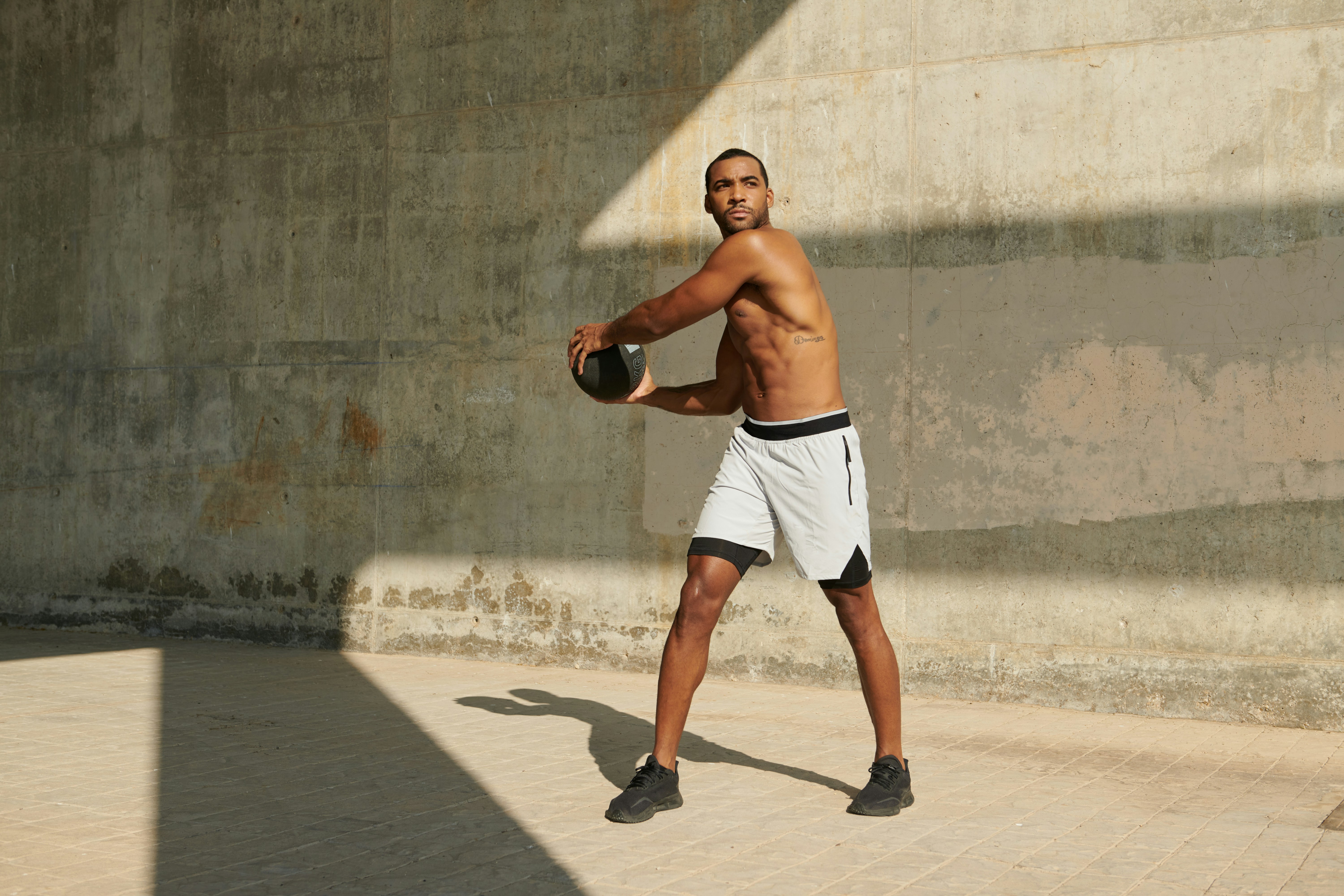 man in black tank top wearing black headphones