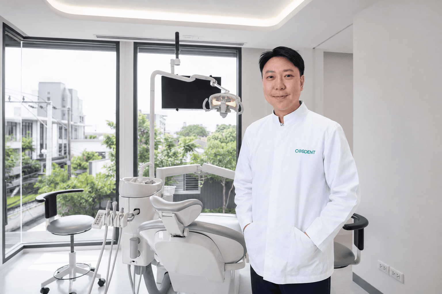Dr. Daniel in a COSDENT Smile Design treatment room in Bangkok (illustrative composite)