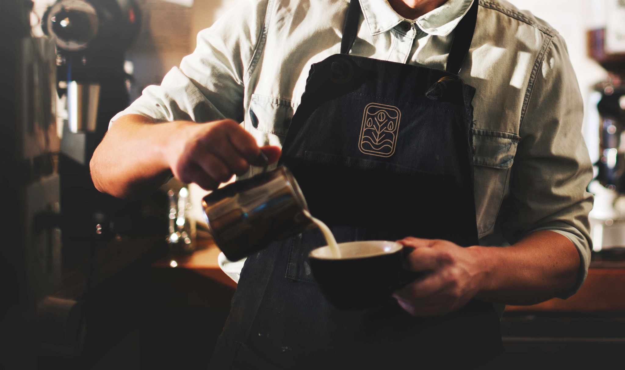 barista pouring coffee