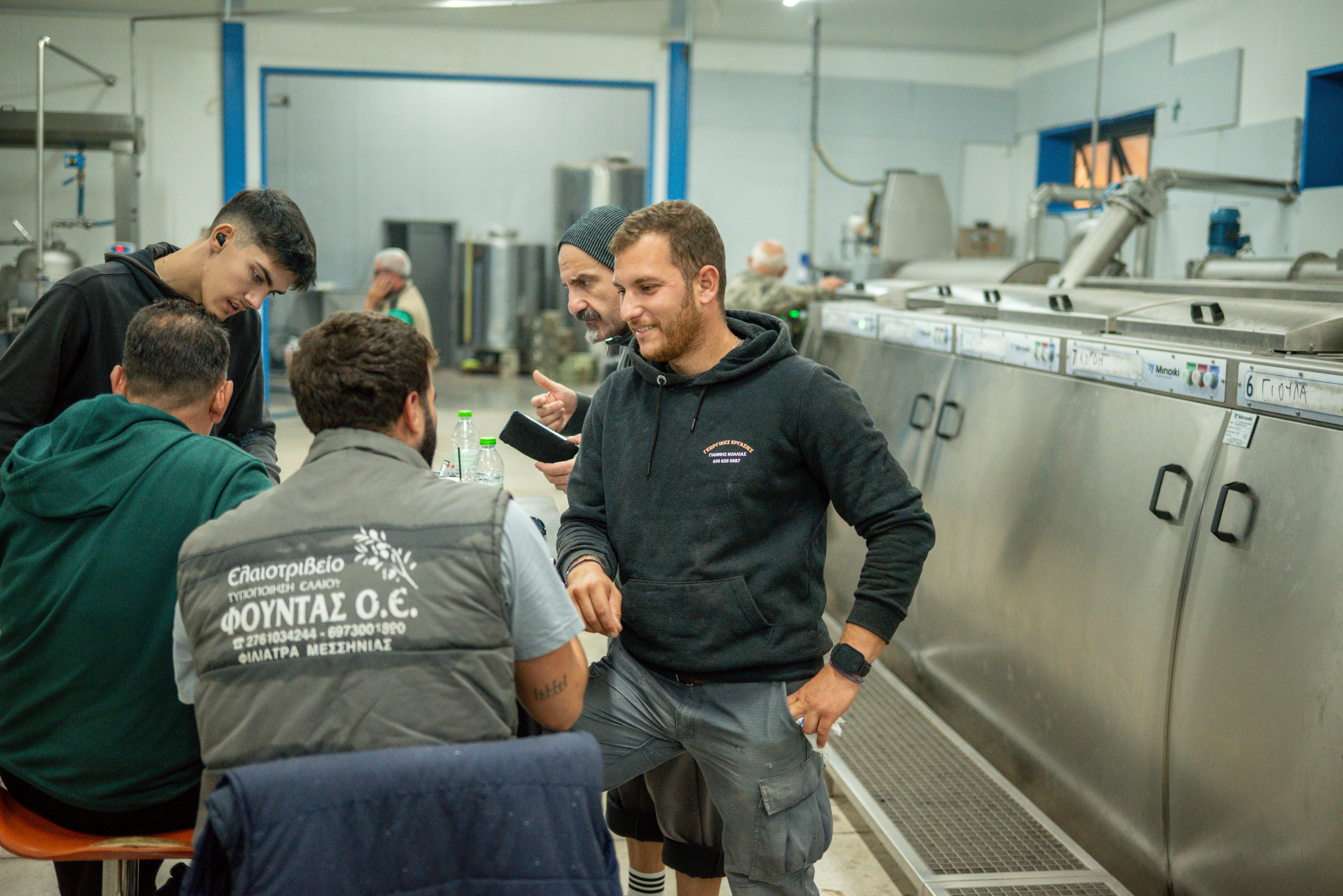 The dedicated professional team at Fountas olive oil mill in Filiatra, Messenia, during the extra virgin olive oil production process.