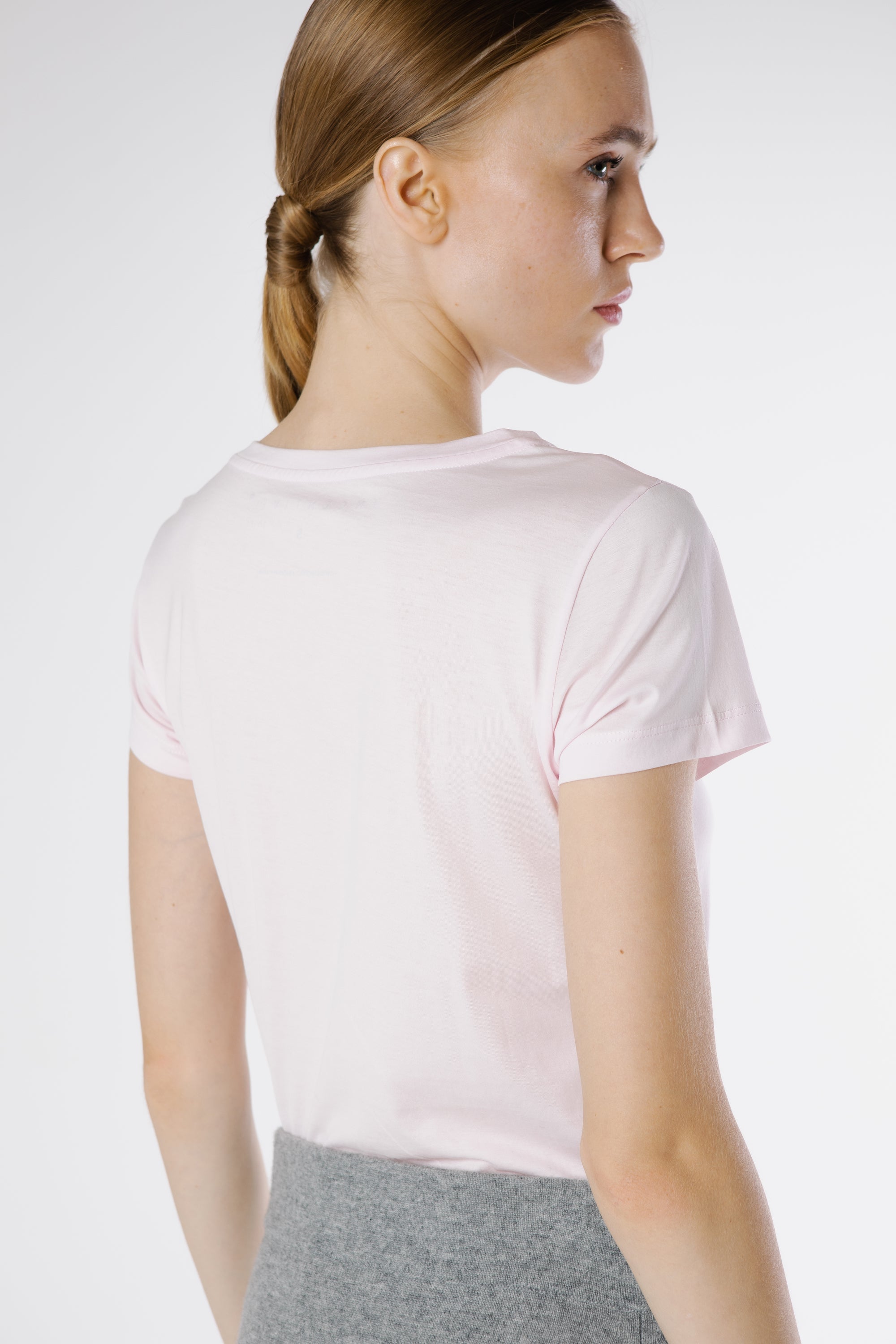 Back view of EcoLuxe Tee Rosa Polvo highlighting the smooth organic cotton texture and clean minimalist lines