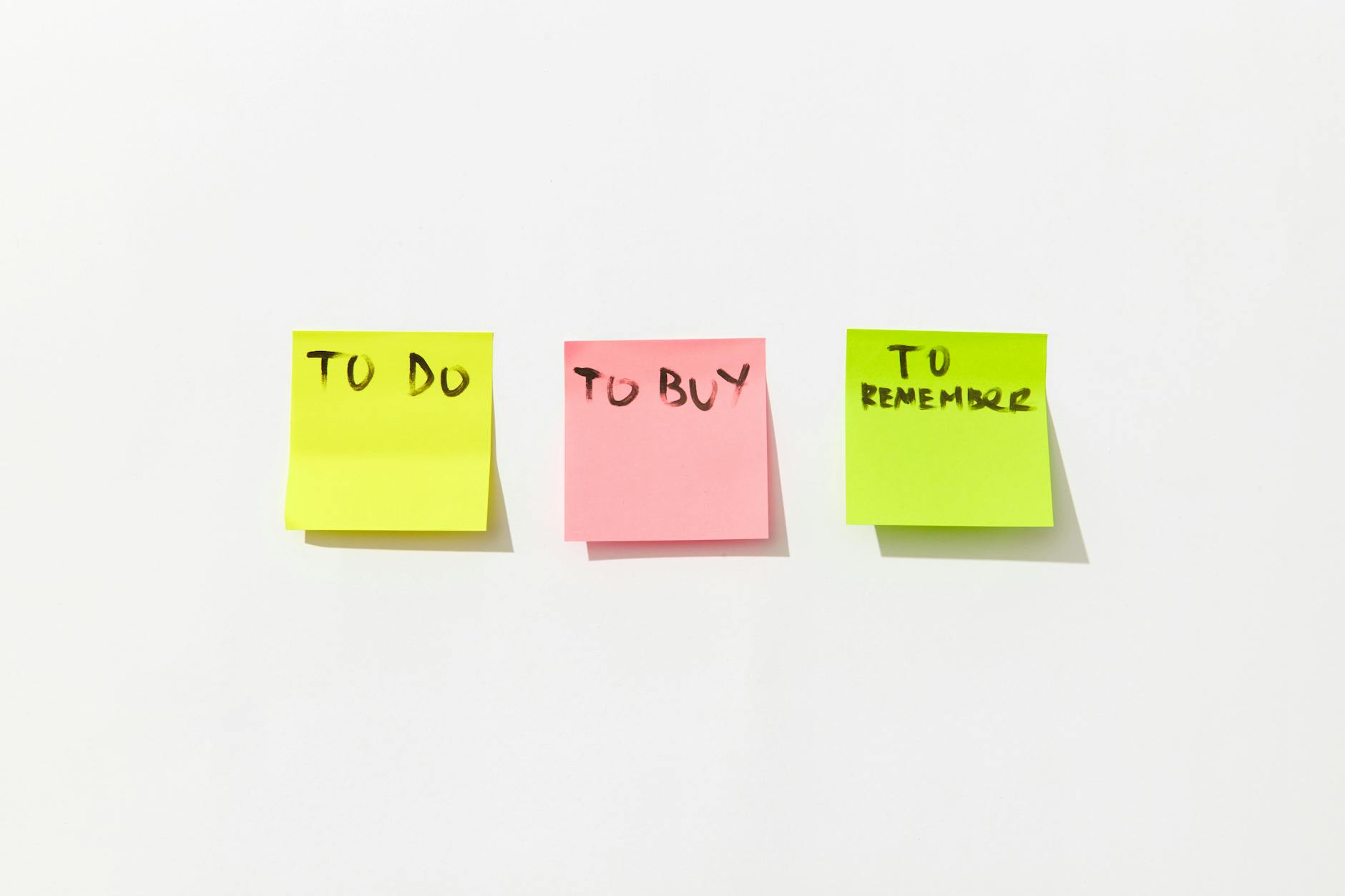 A bright classroom bulletin board displaying colorful posters of different collaborative learning techniques.