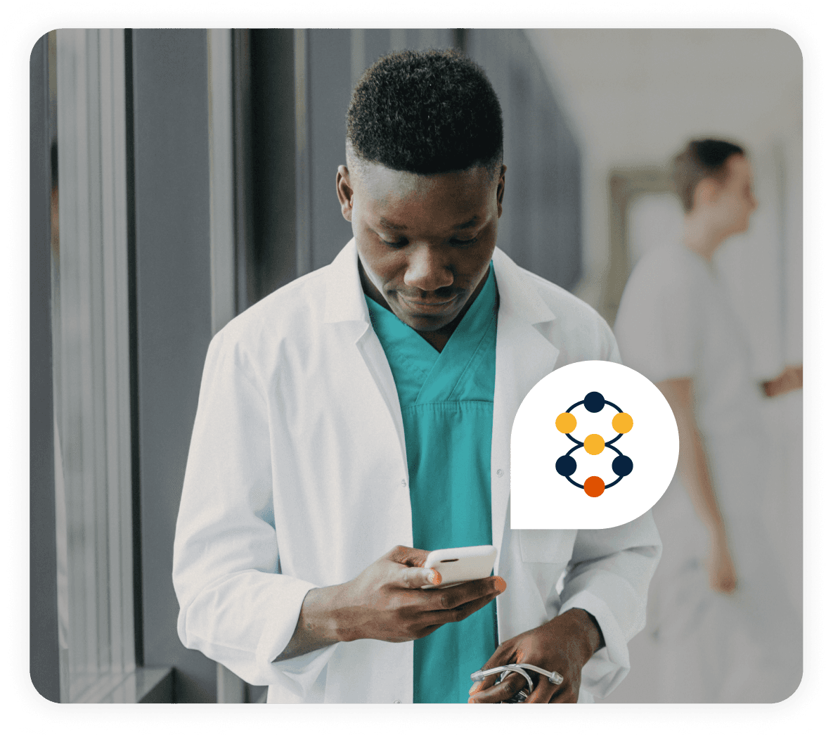 Black male doctor looking at a phone, with a Vula icon in a chat bubble coming out of it.