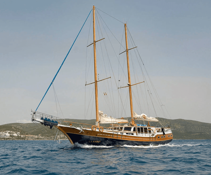 Traveler walking across golden sand dunes in AlUla under morning light.