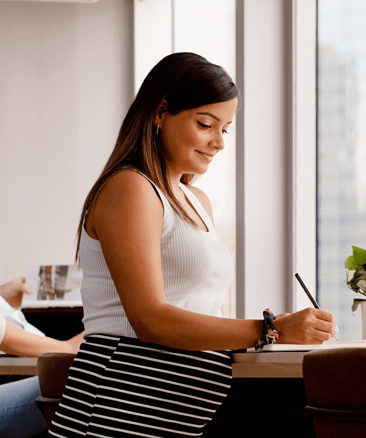 Bullish culture promo. Pregnant woman working