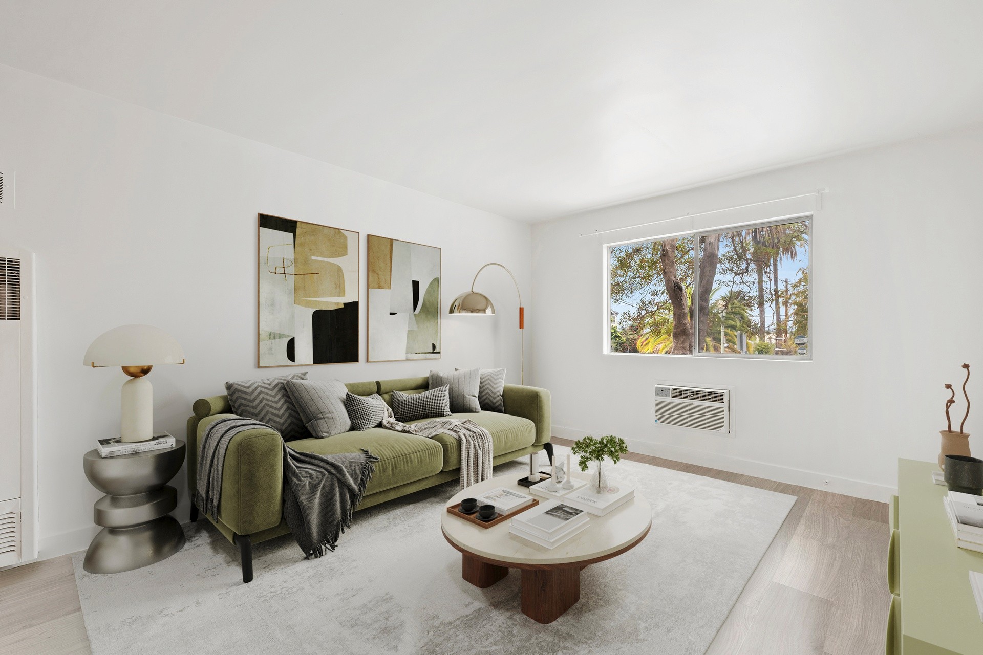 200 N Rampart staged living room with modern furniture, large window views and bright open layout.