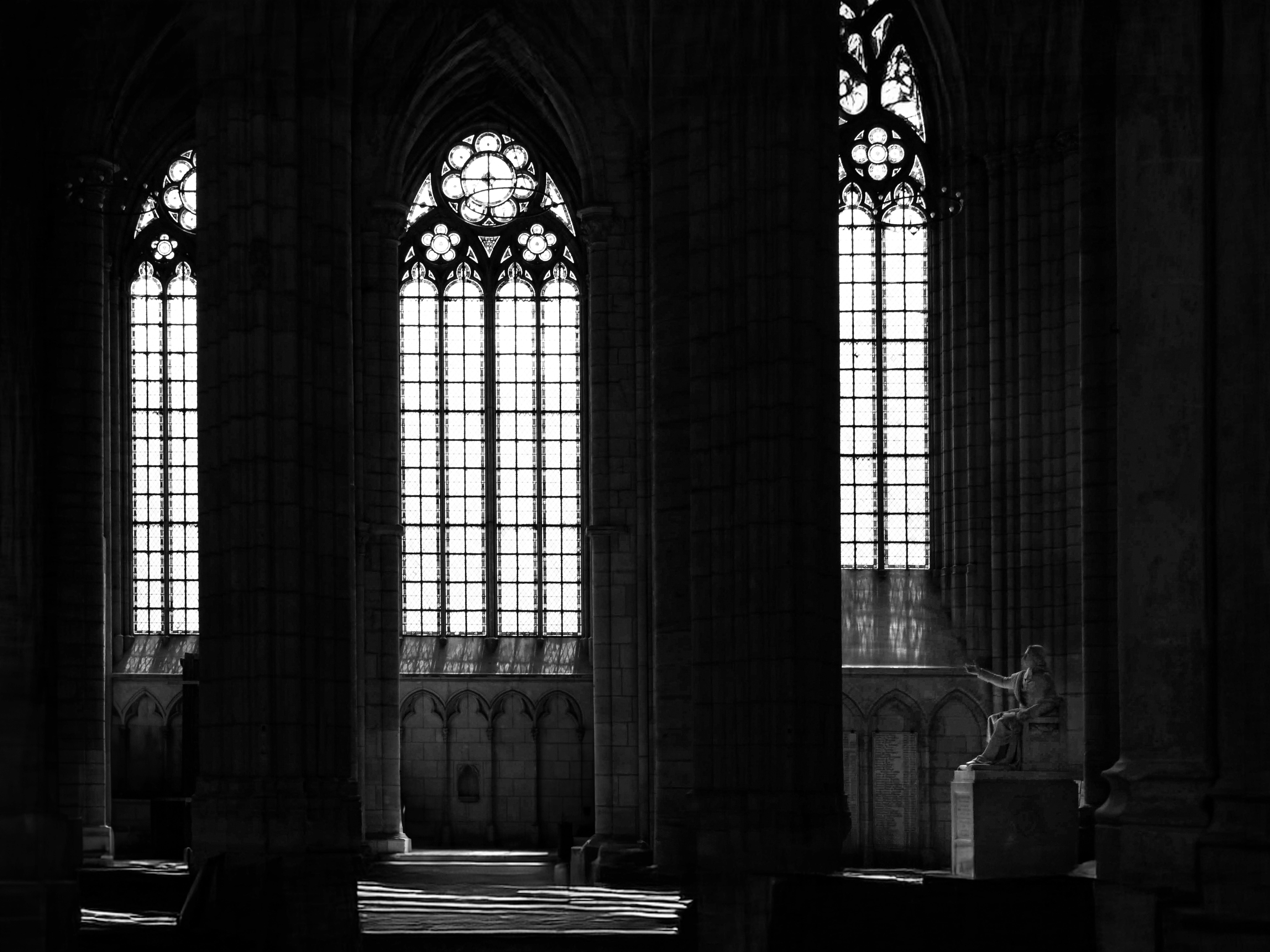 Person sitting on a ledge overlooking New York City skyline