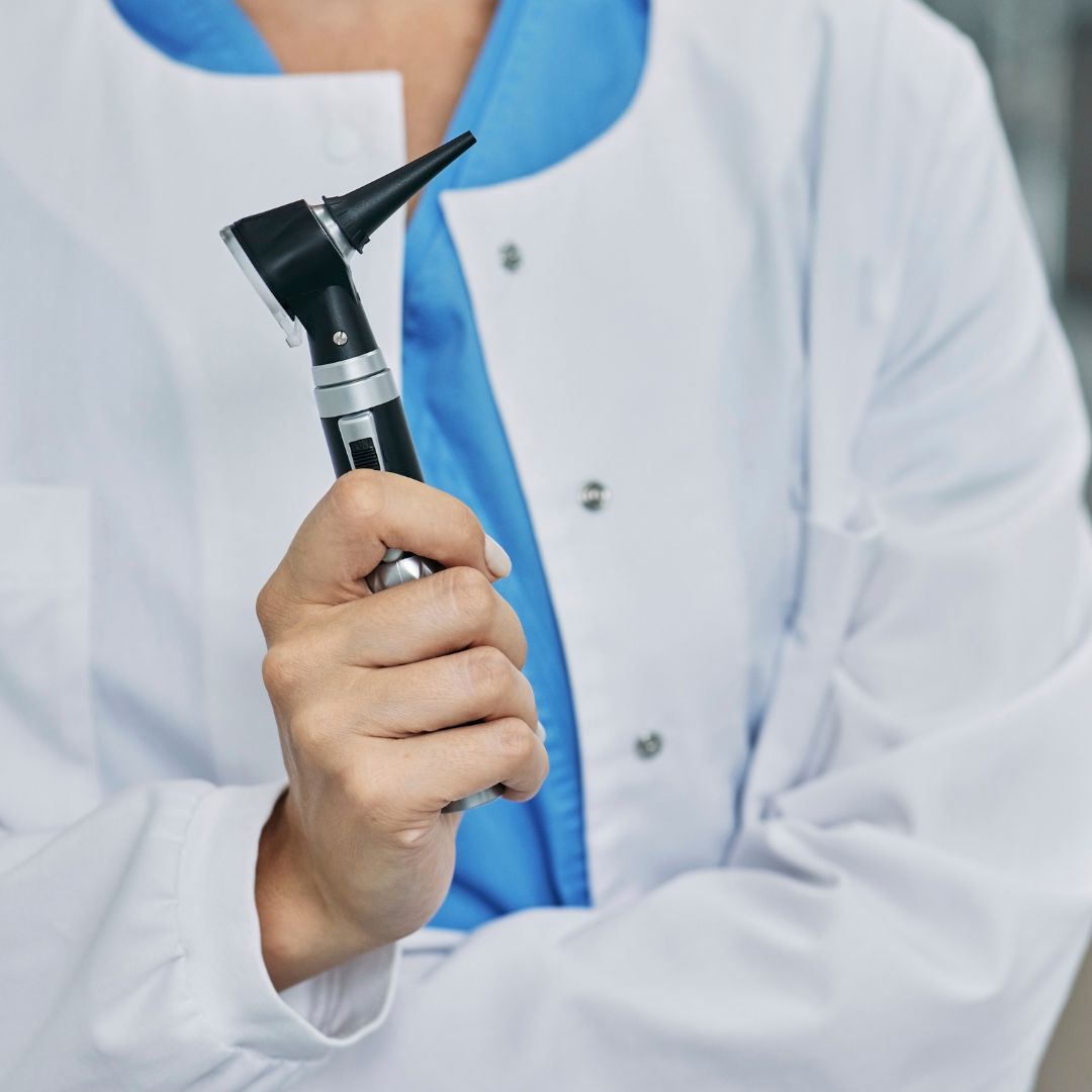 audiologist holding otoscope