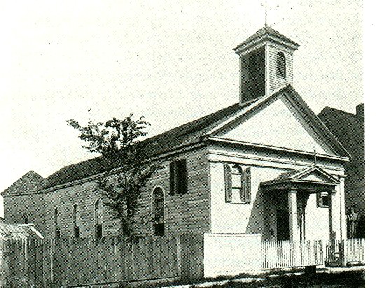A black and white picture of a church