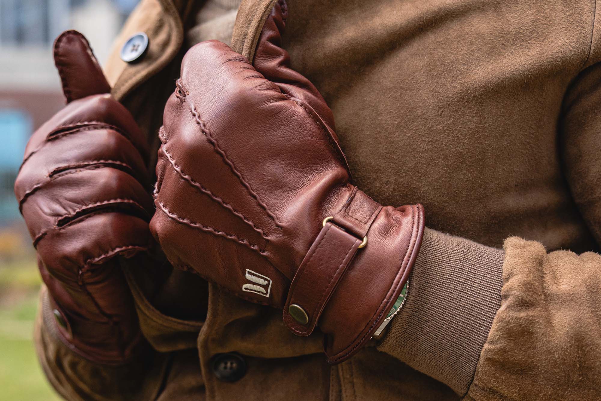 Close up of brown leather gloves worn by a Don Marrón model shot by Quickie Studio