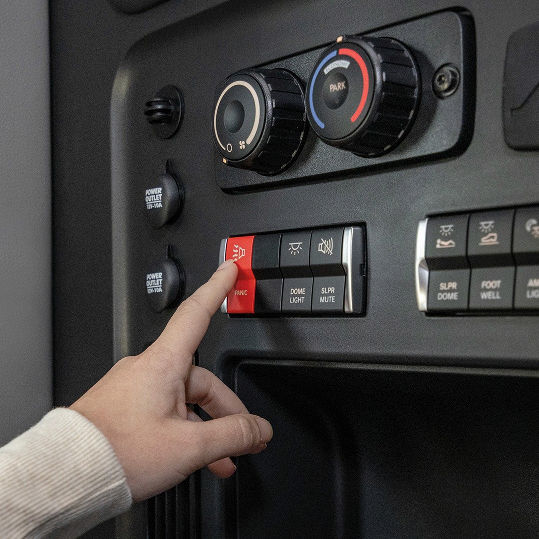 Truck driver turning off a vehicle safety system, highlighting survey findings.