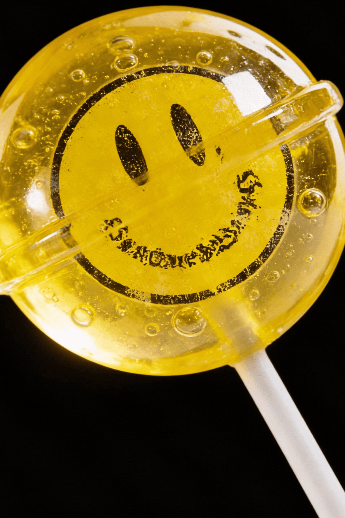 Rose-gold lipstick on black background