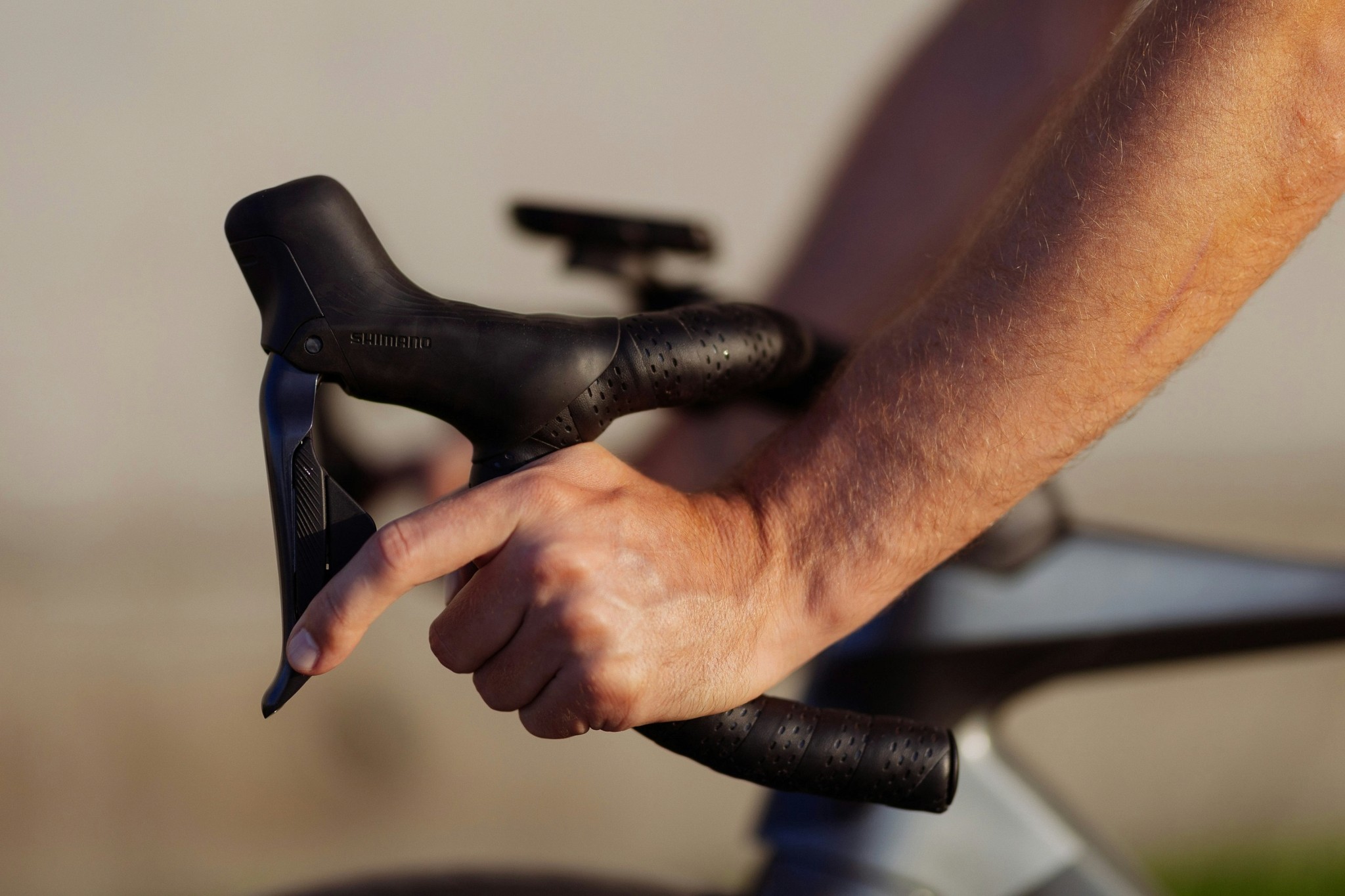 Person Gripping Bicycle