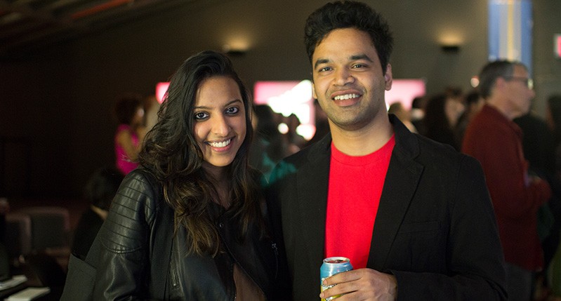 woman in leather jacket and men with red shirt