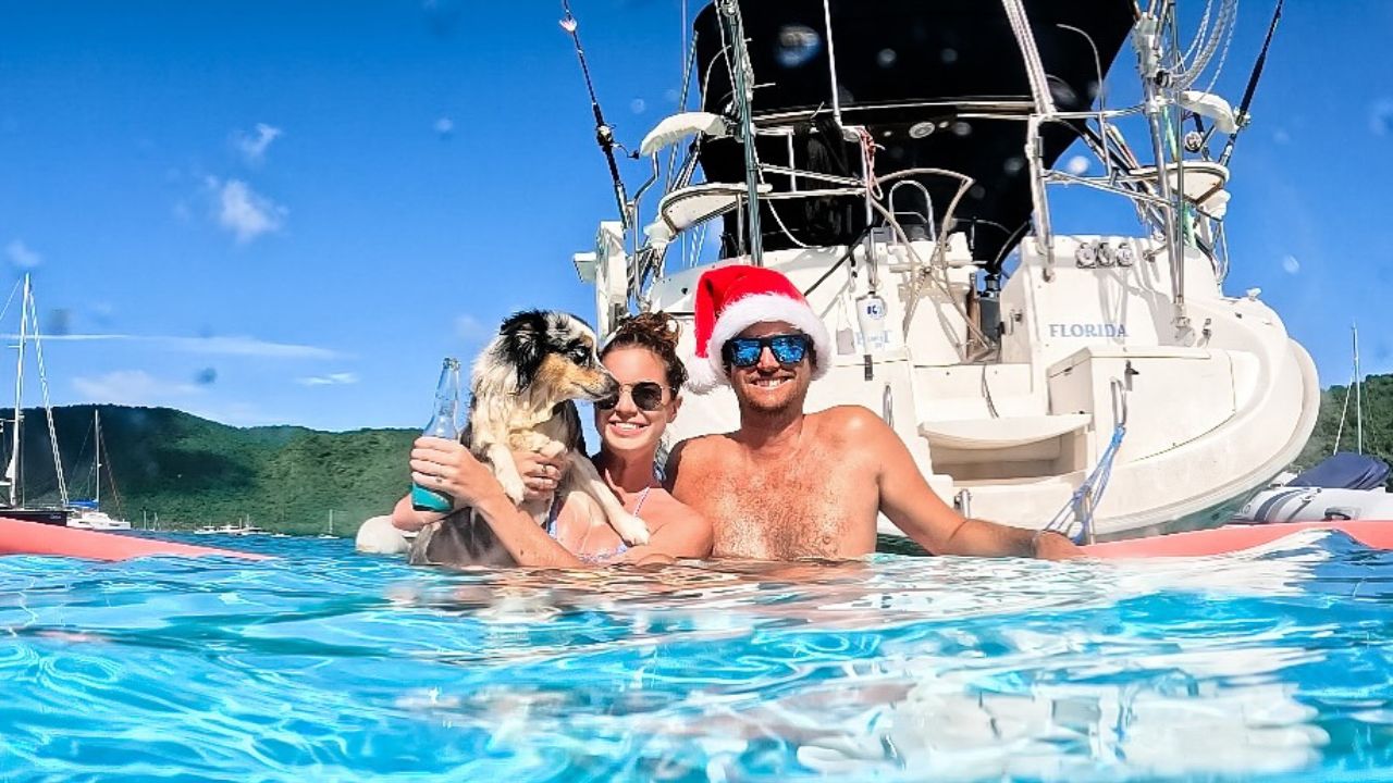 Emma and Andrew Knott from SailingAfterglow and their mini Aussie,Isla