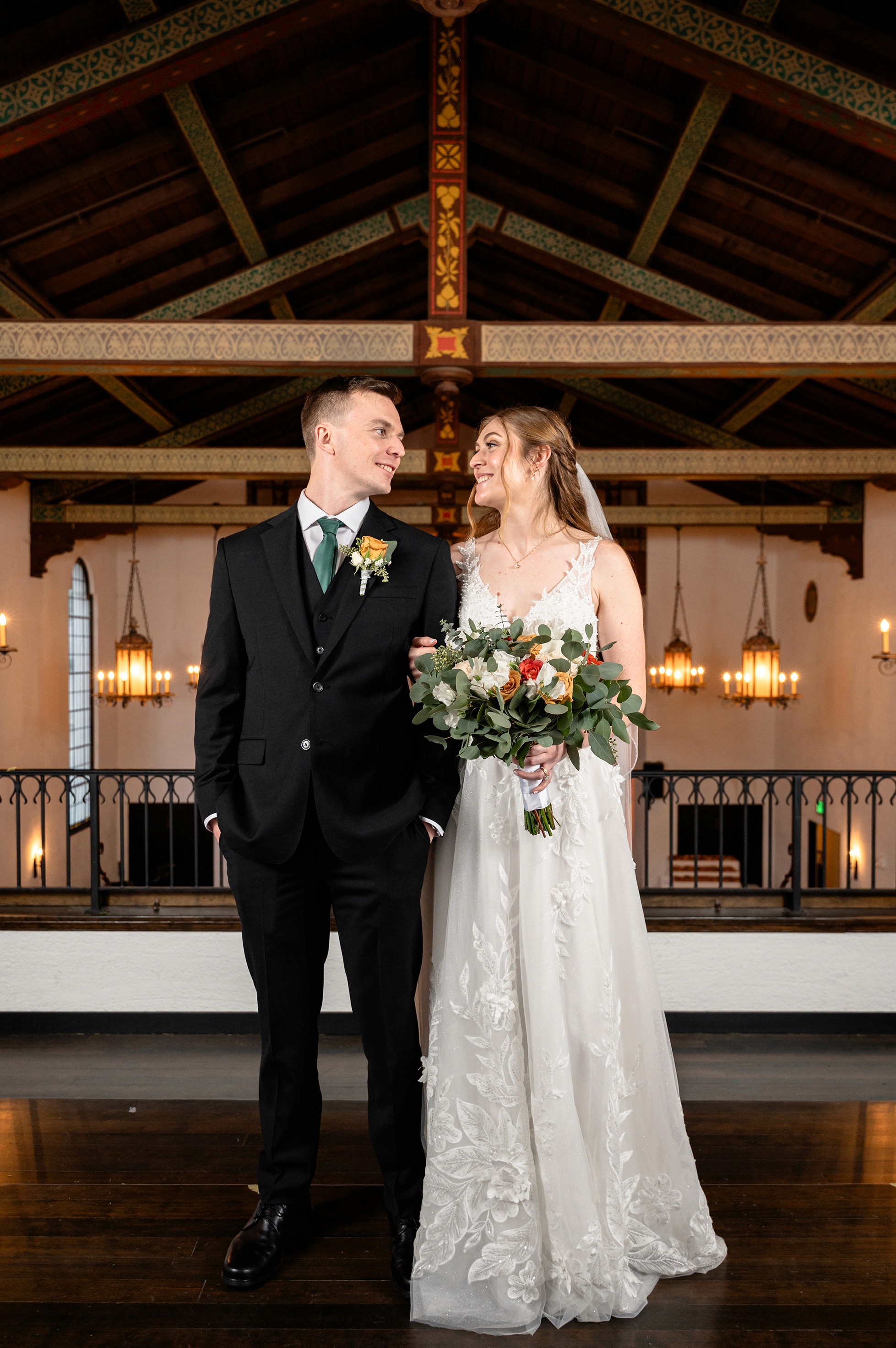 Flat lay wedding details with bouquet, rings, and sparkling bridal heels