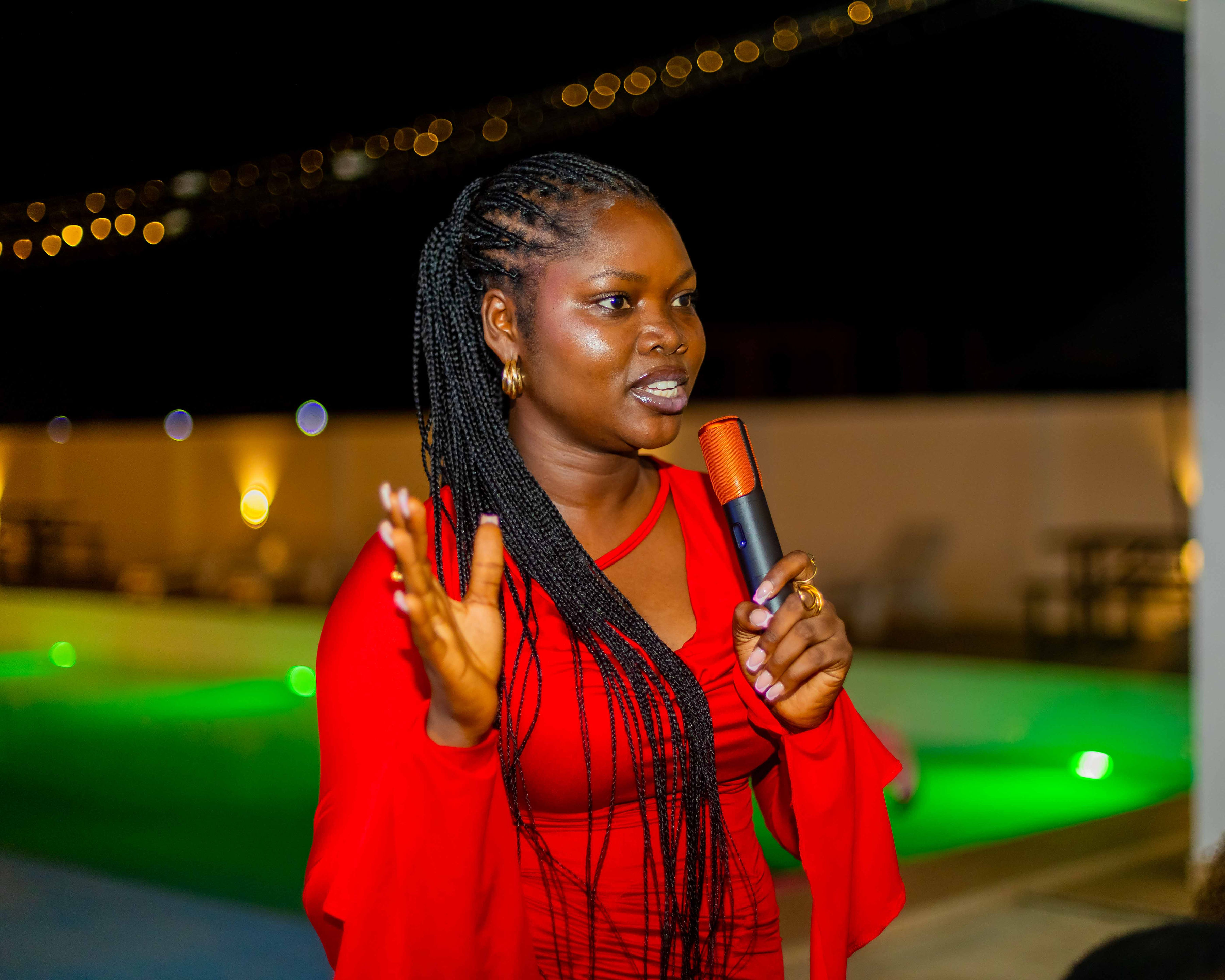 Hannah Olaniyi speaking into a microphone