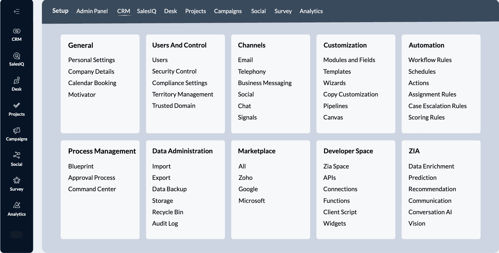 A group of colleagues sitting around a conference table with laptops, listening to a woman leading the meeting in a modern office setting.