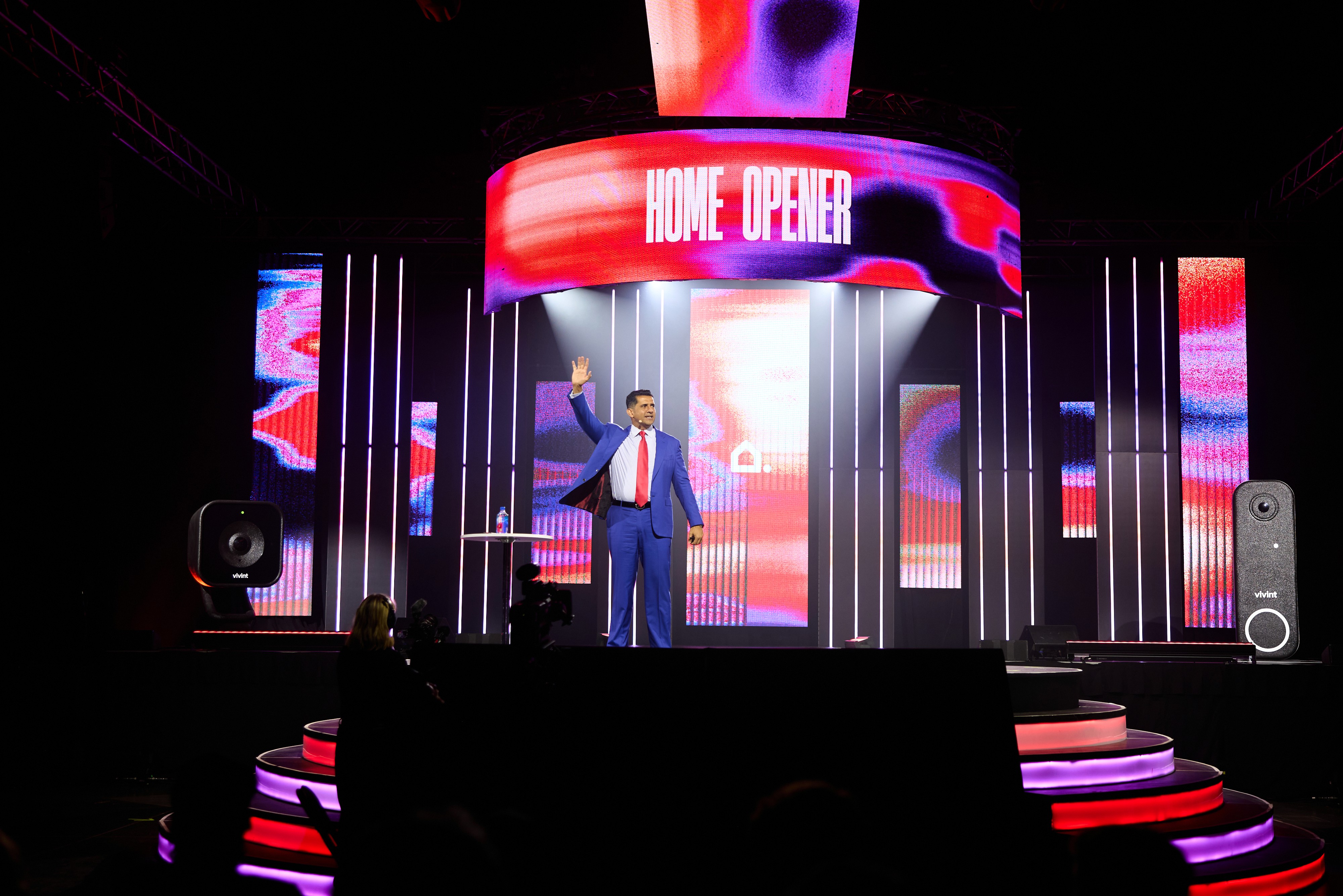 A fast black sports car races down the highway.