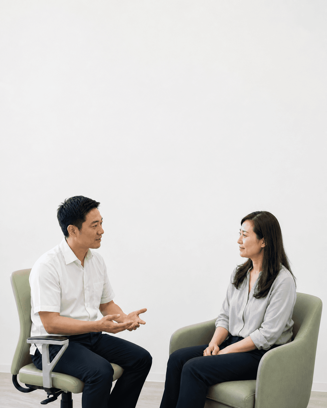 A clinician listening to a patient in a bright consultation room. AI-generated demo scene.