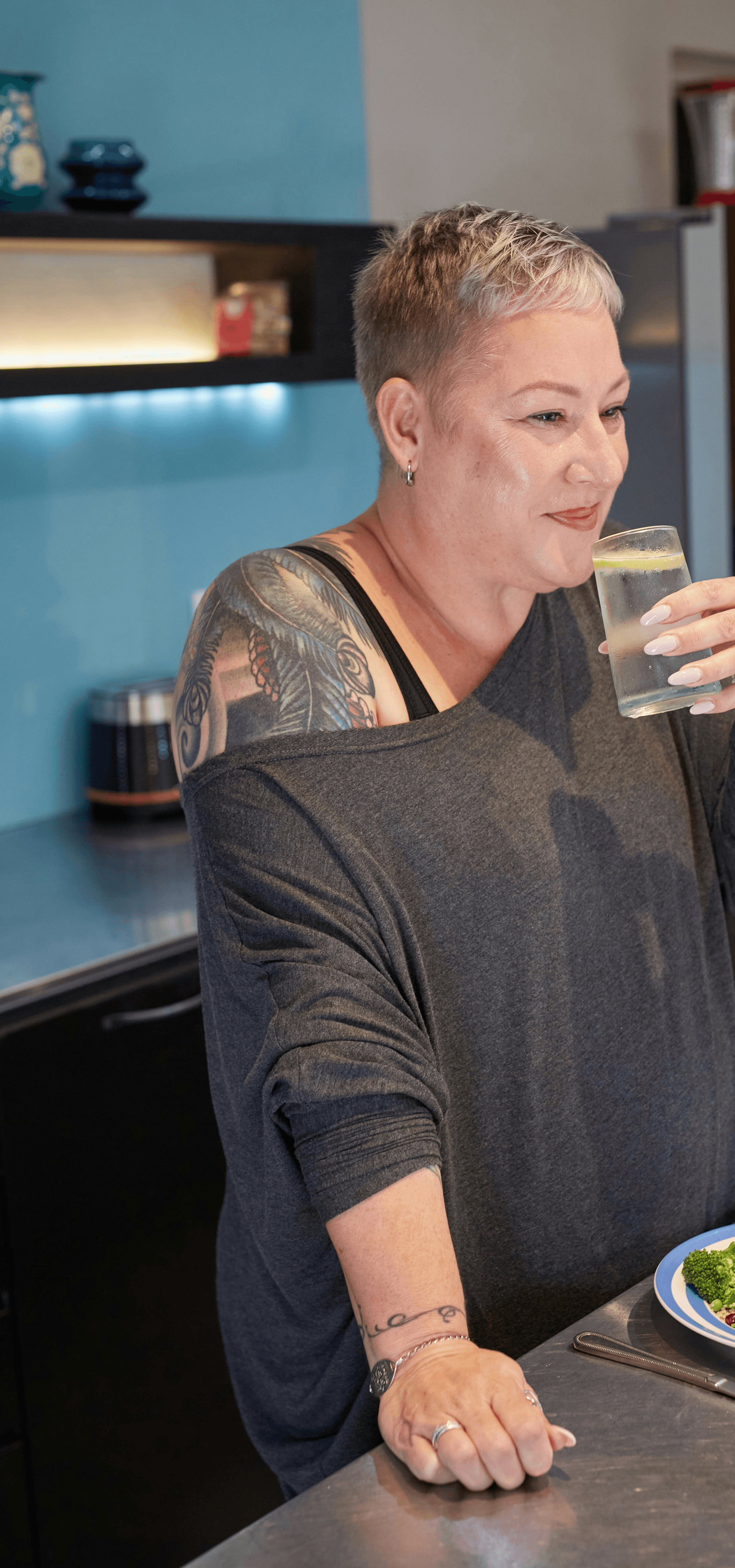 a person enjoying a glass of water