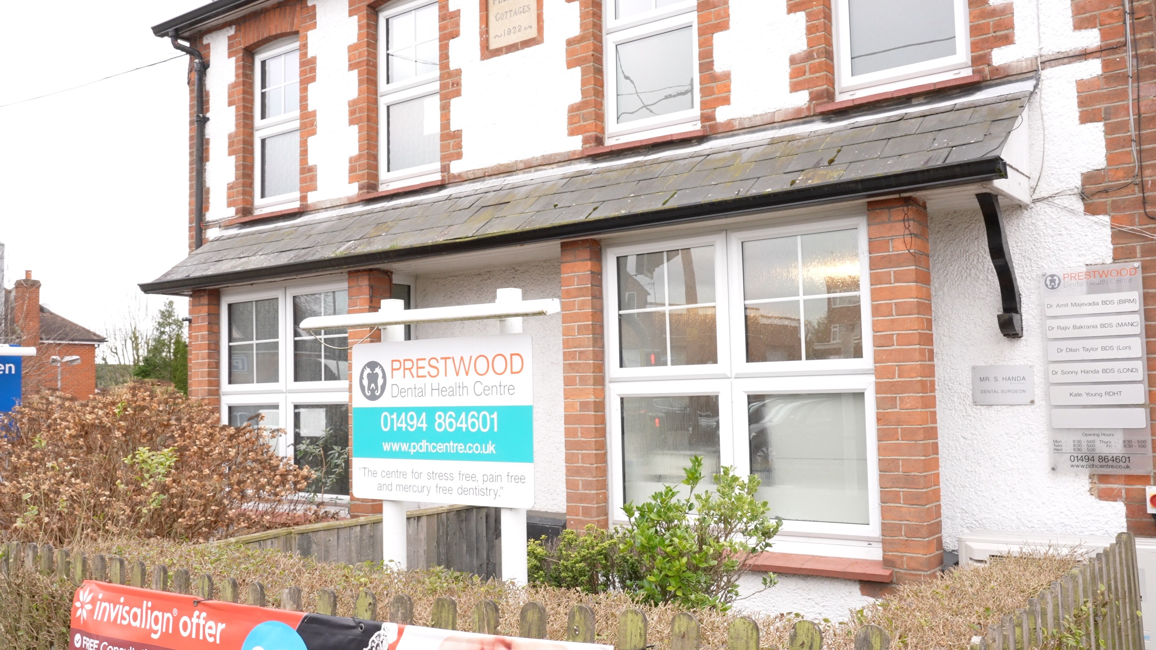 low angle photo of beige concrete building under cloudy sky