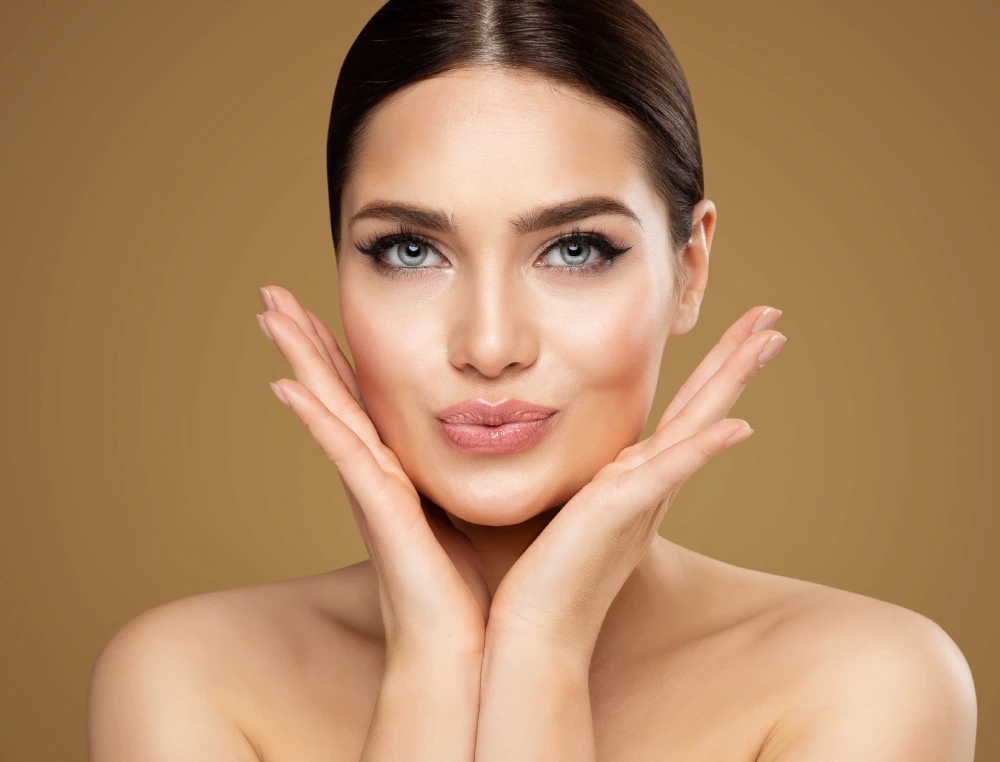 Woman showing radiant skin after a med spa treatment.