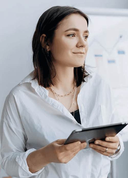 Mother and daughter watch something on a tablet.