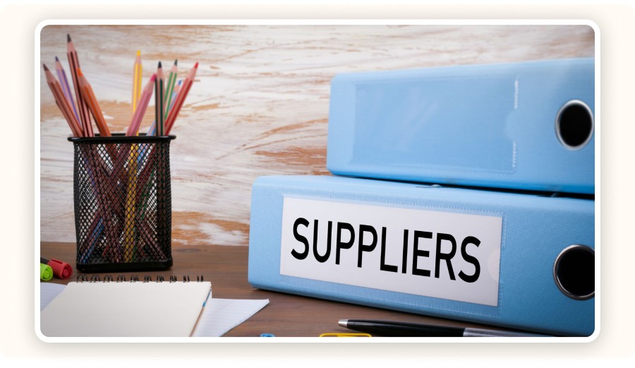 Blue binders labeled “SUPPLIERS”