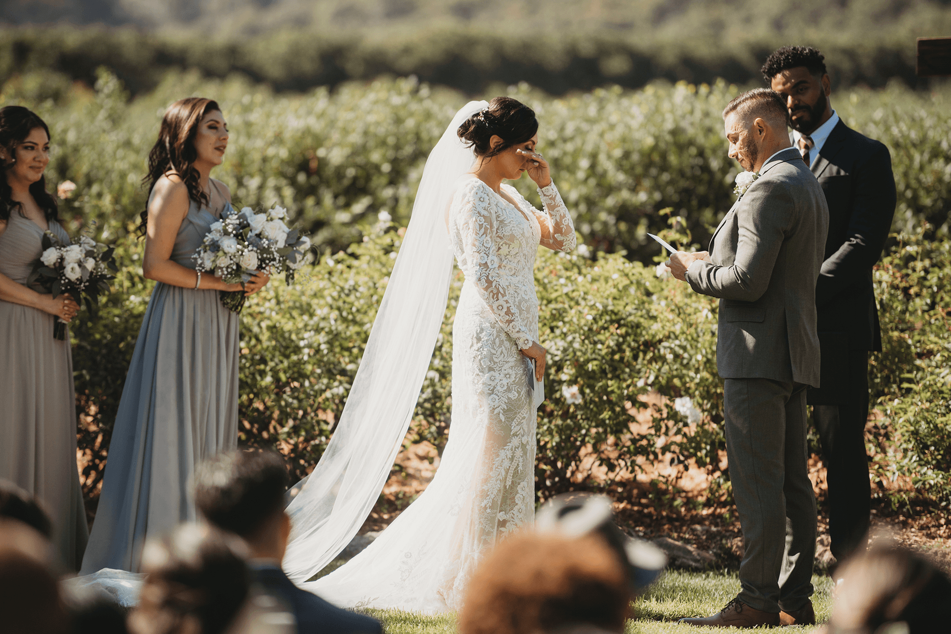 Flat lay wedding details with bouquet, rings, and sparkling bridal heels