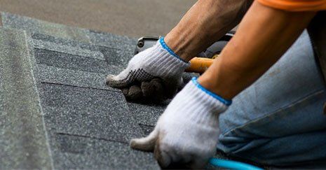 Roofing Repairs — Contractor Installing Roof Shingles in Prineville, OR