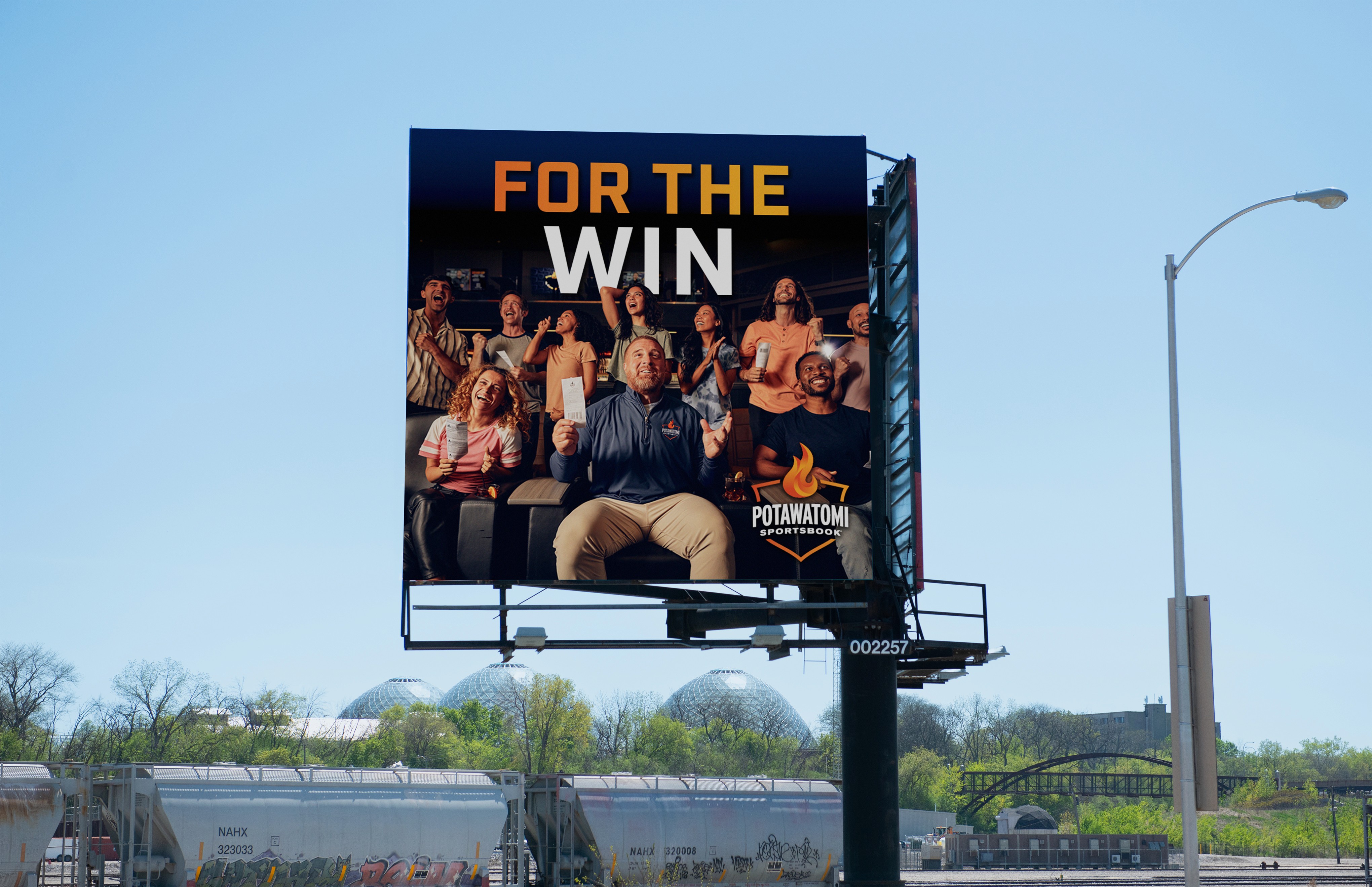 Billboard of John Kuhn reading "For the Win"
