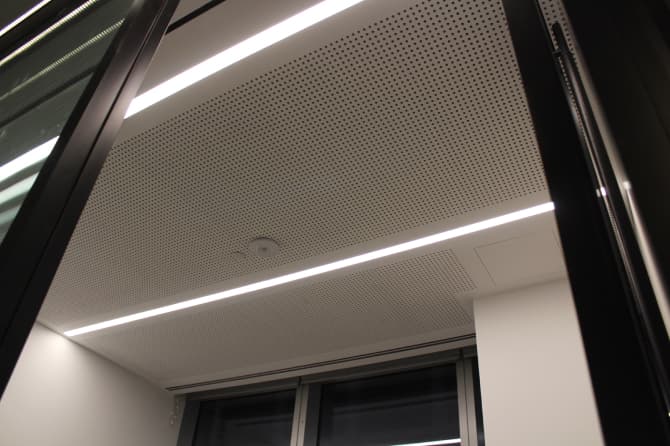 Long bar lighting along a ceiling