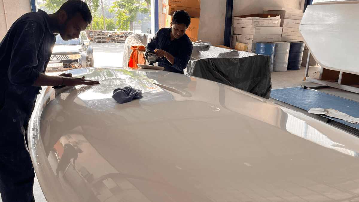 a person swimming in the water with grass