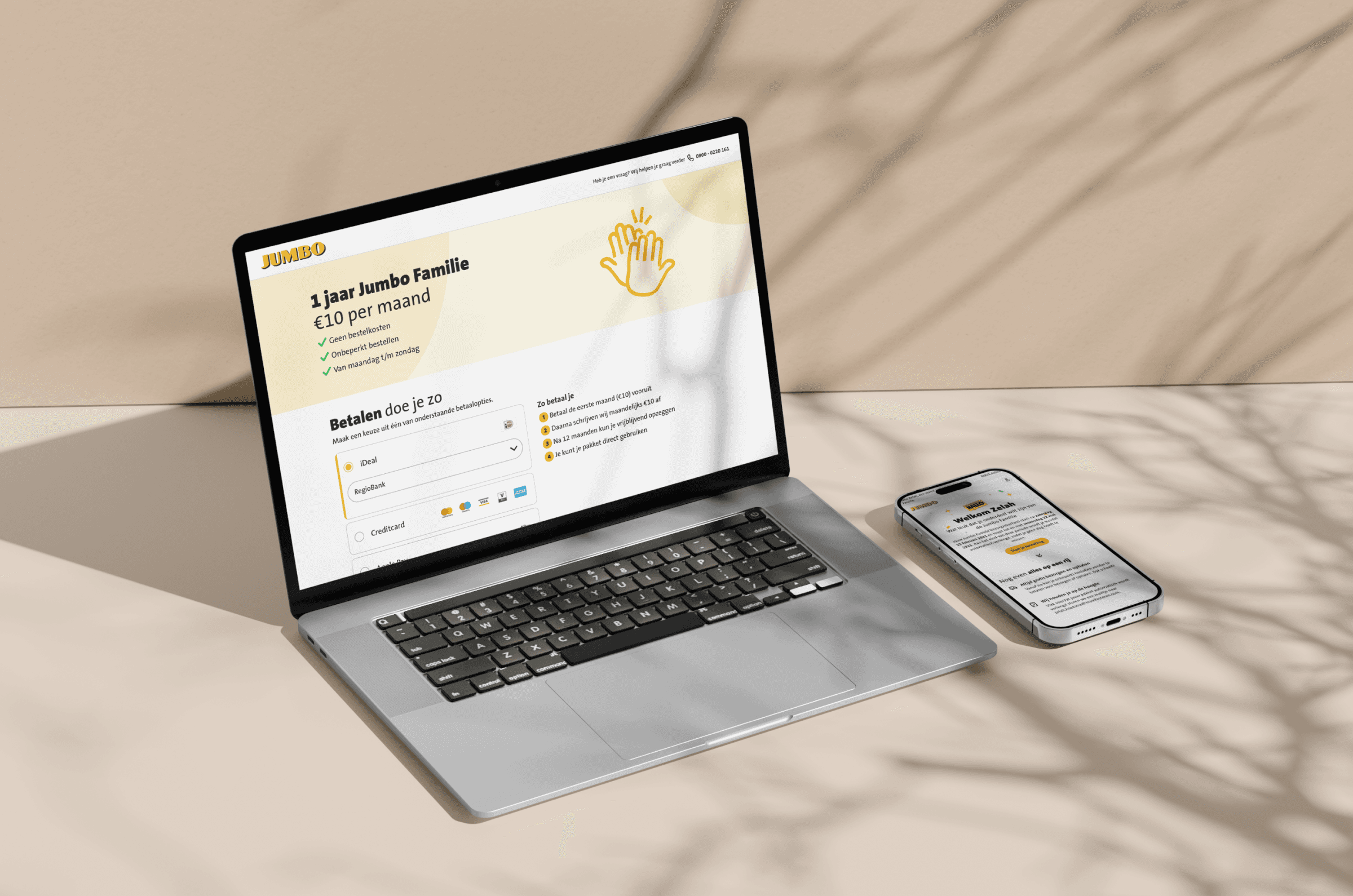 A mockup of a Macbook and phone of jumbo subscription model