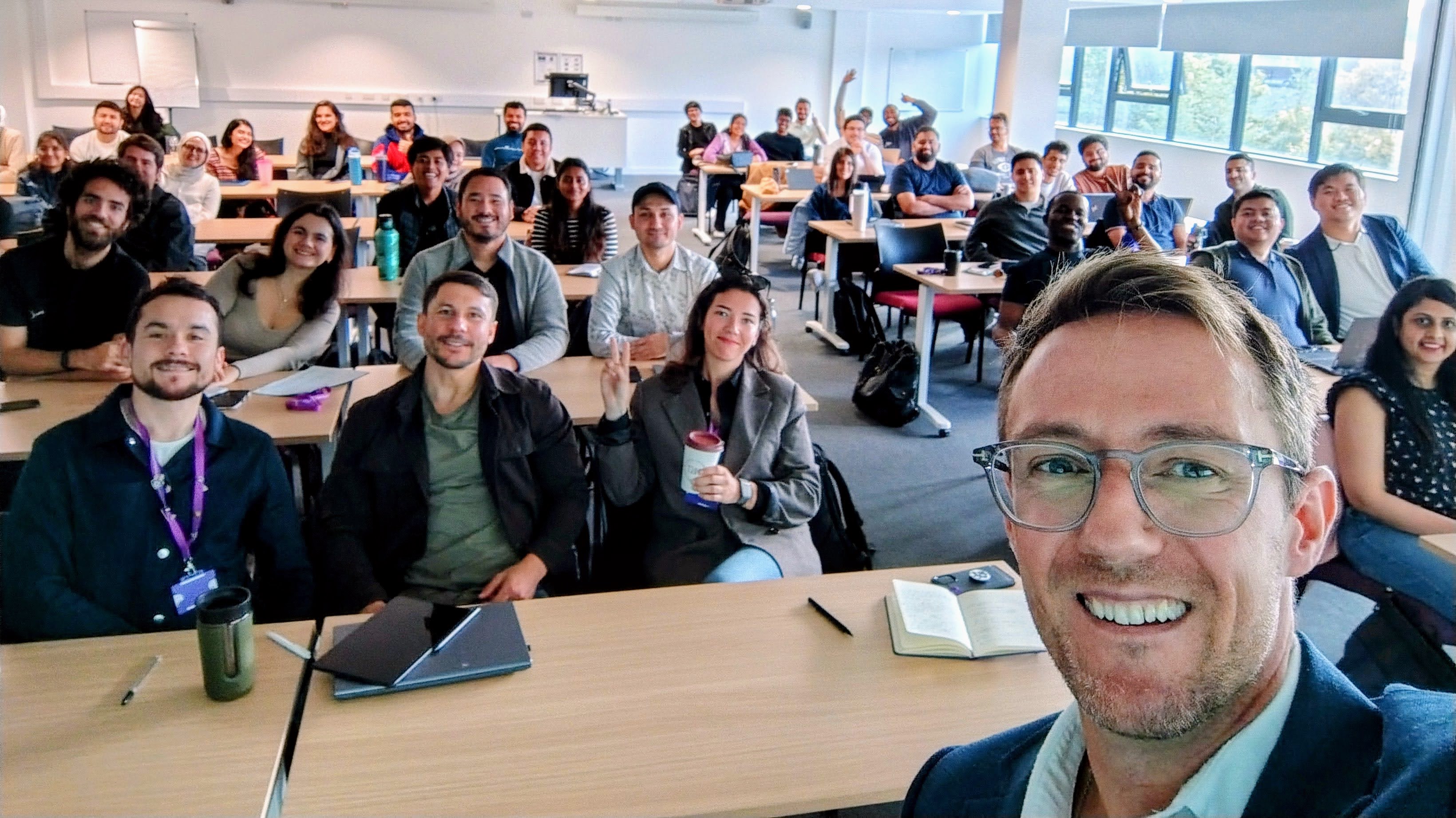 Guest lecture on self-leadership — packed classroom, interactive session.