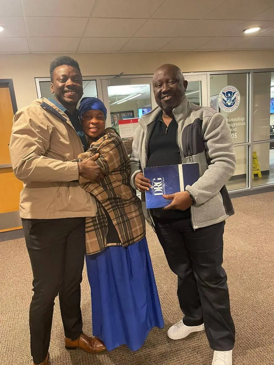 Ecstatic individual holding U.S. flag after naturalization, aided by Fibi Law