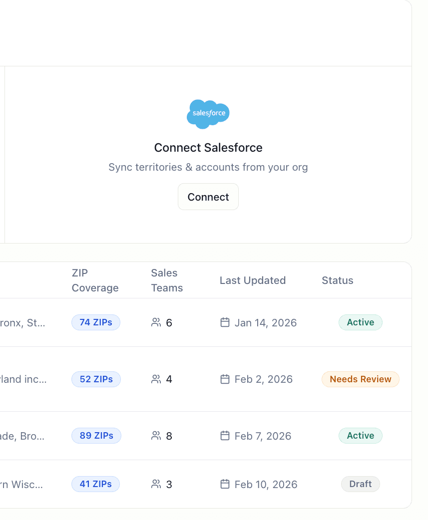 Woman looking at a computer screen in warm natural light, focused and thoughtful, with sunlight casting soft shadows on the wall behind her.