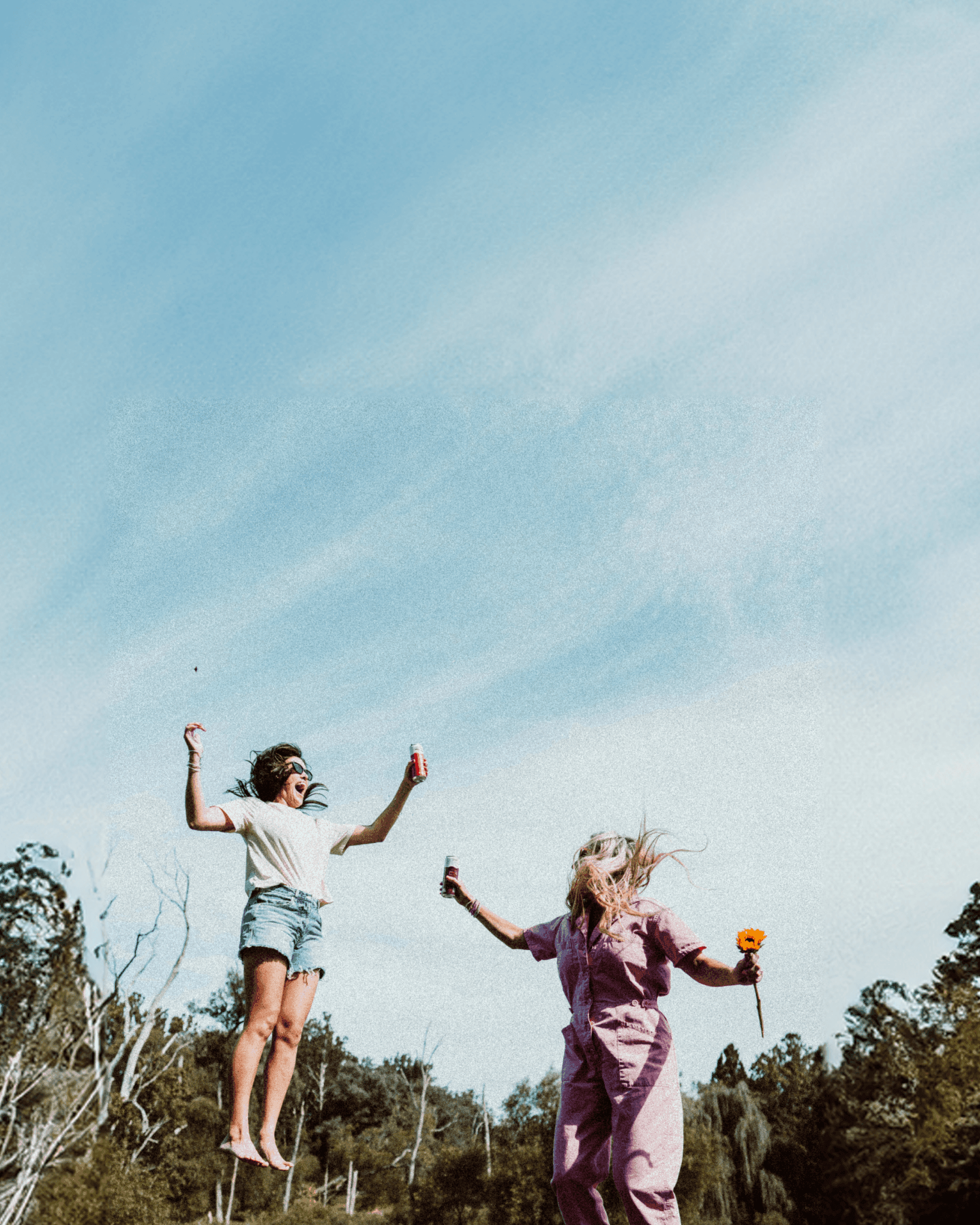 photo of models holding sunnies socials cans