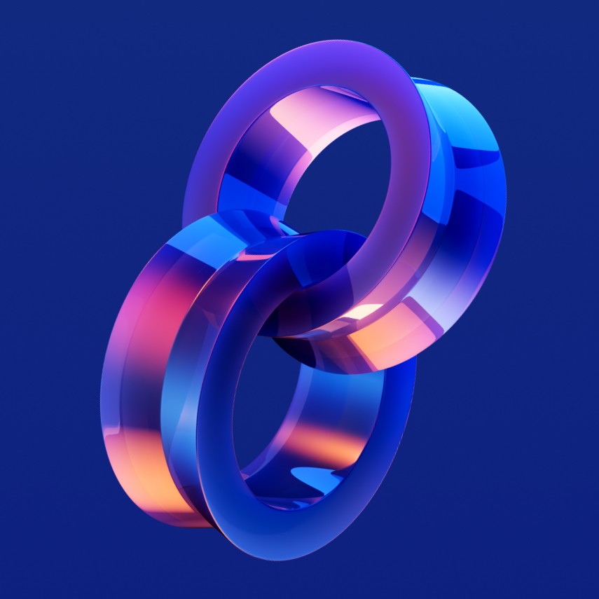 Two interlocking rings with a glossy, translucent finish in shades of blue and pink against a dark blue background.
