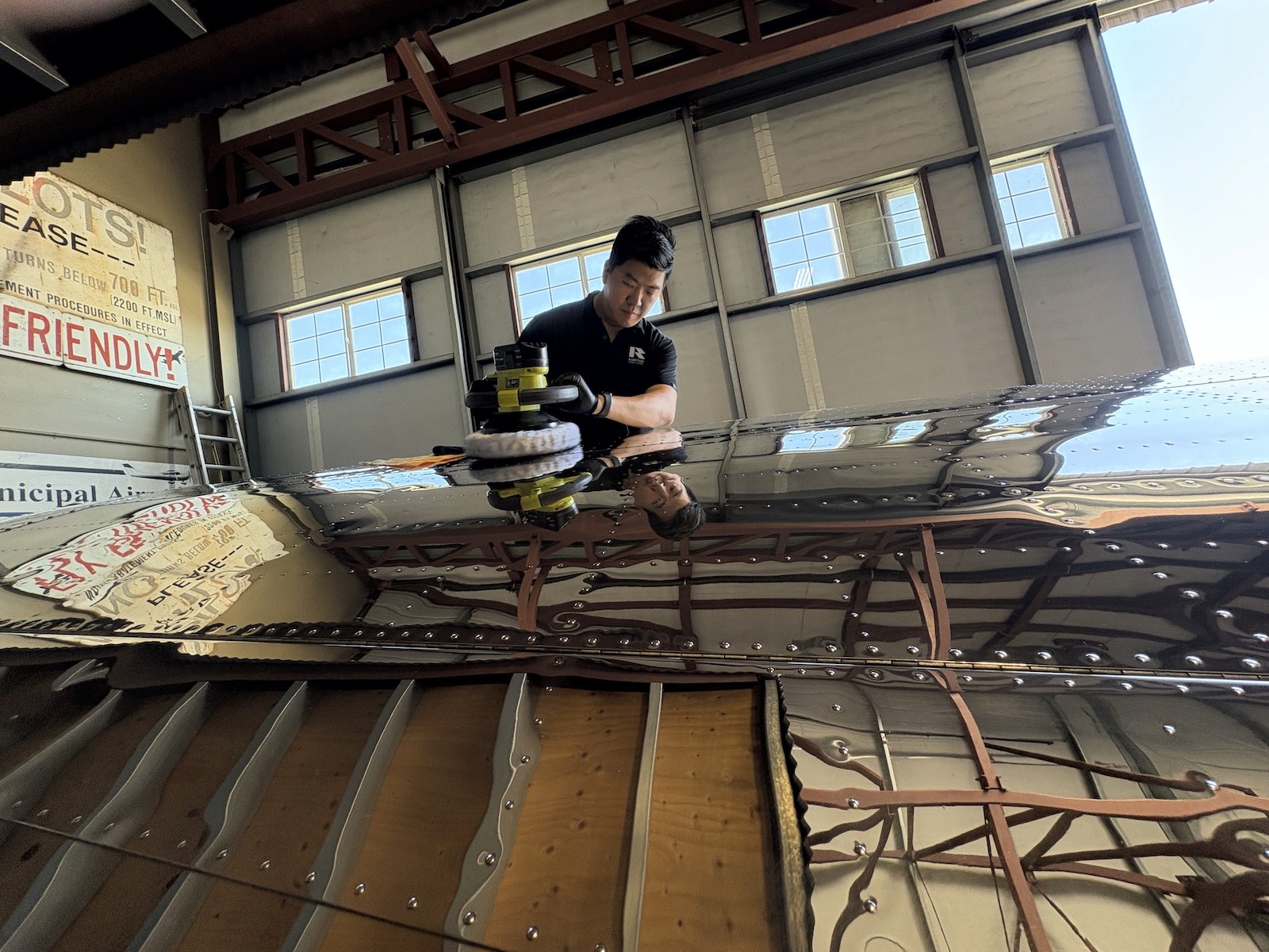 Rampside aircraft detailer polishing a private aircraft surface in Las Vegas