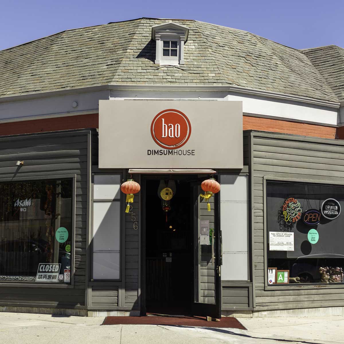 Exterior of Bao Dim Sum House in Los Angeles with red lanterns and signage, welcoming guests to an authentic Chinese dining spot.
