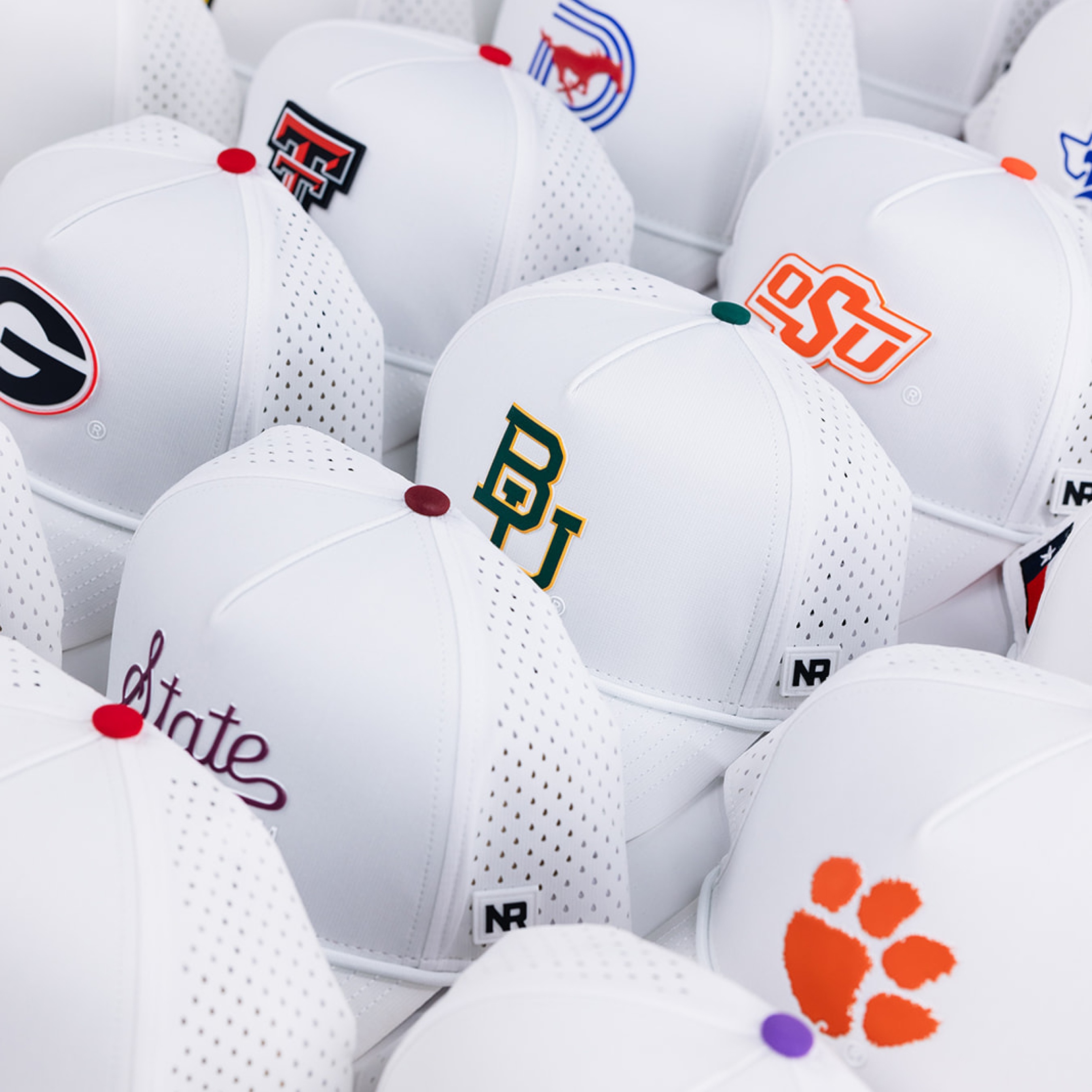 Streetside billboard with flyposters of the Batch.Works brand and illustrations