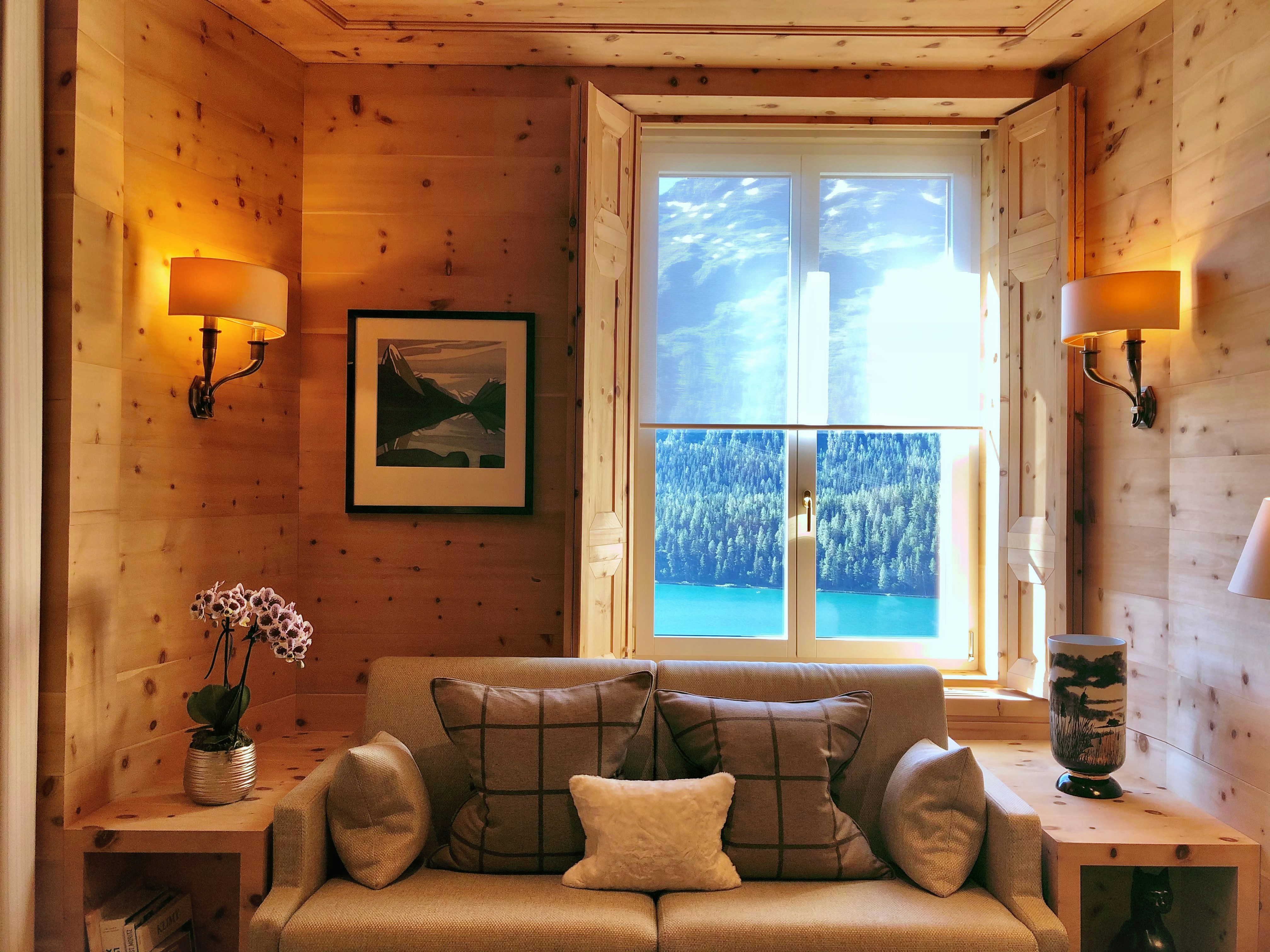 Cozy living room with a fireplace and mountain views.