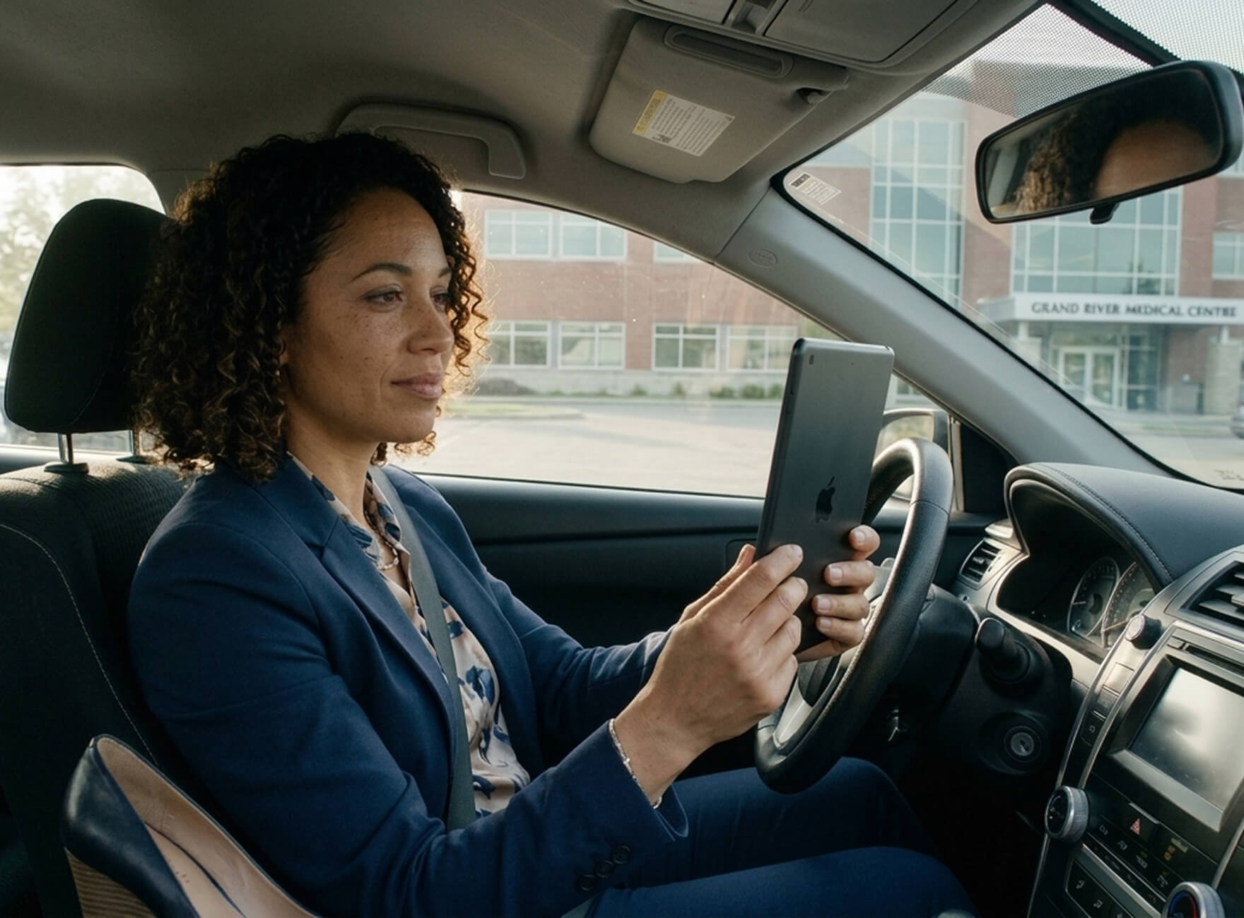 Woman holding a smartphone looking through the glass 