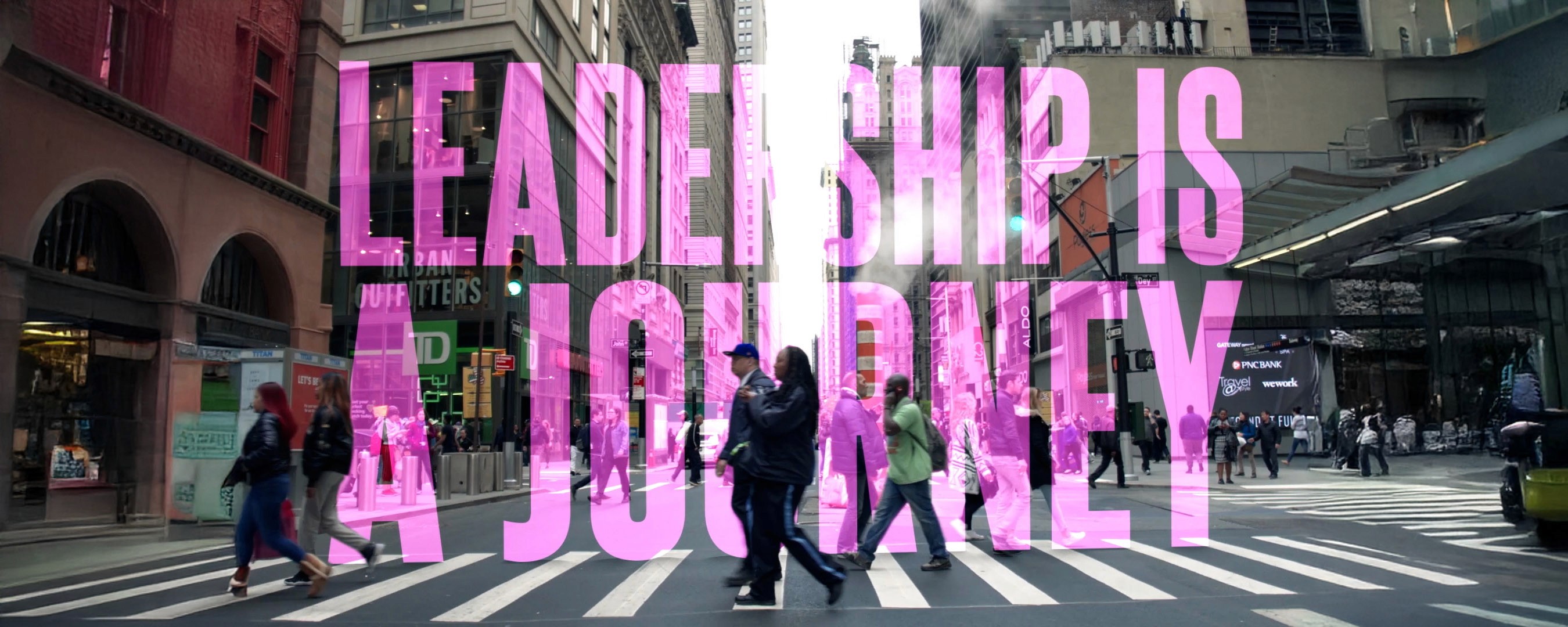 Global Women's Forum pink title saying Leadership is a journey, on the busy background of a street zebra